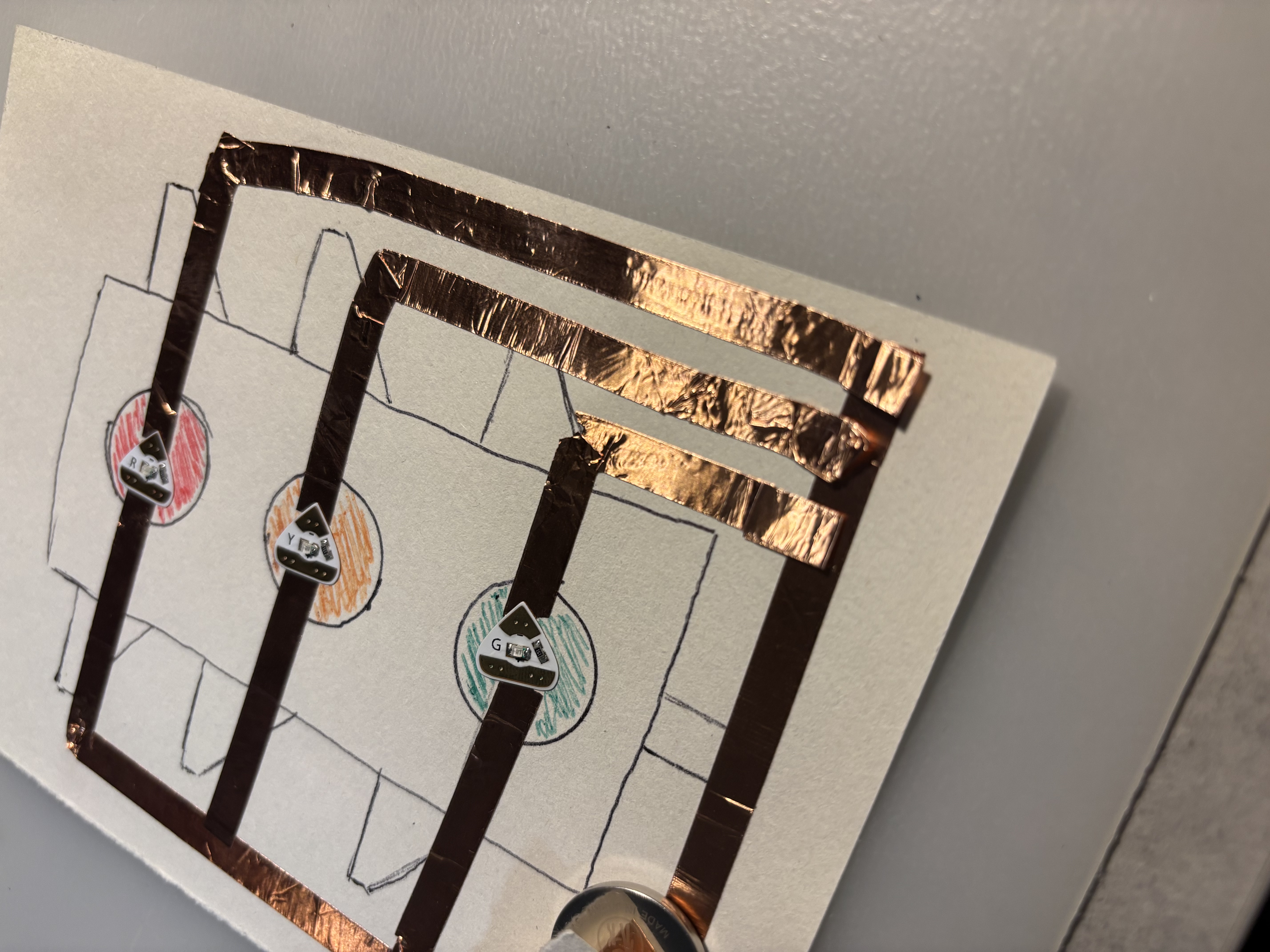 Stop light circuit followed from a tutorial (linked in the pdf).